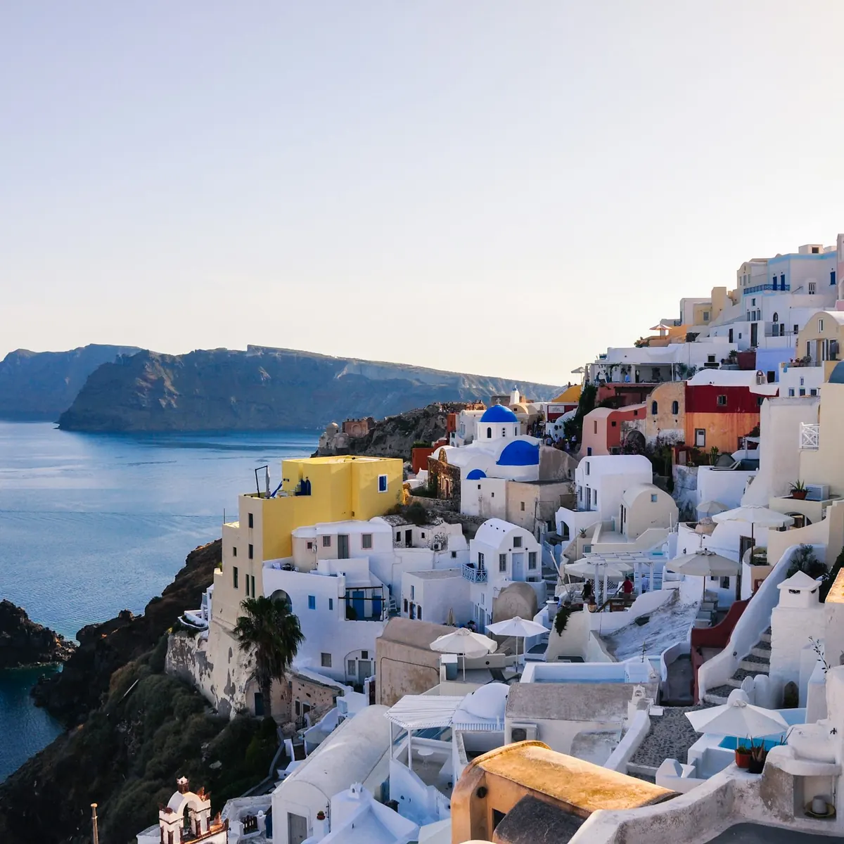 Whitewashed houses of Oia stepping down the Santorini caldera